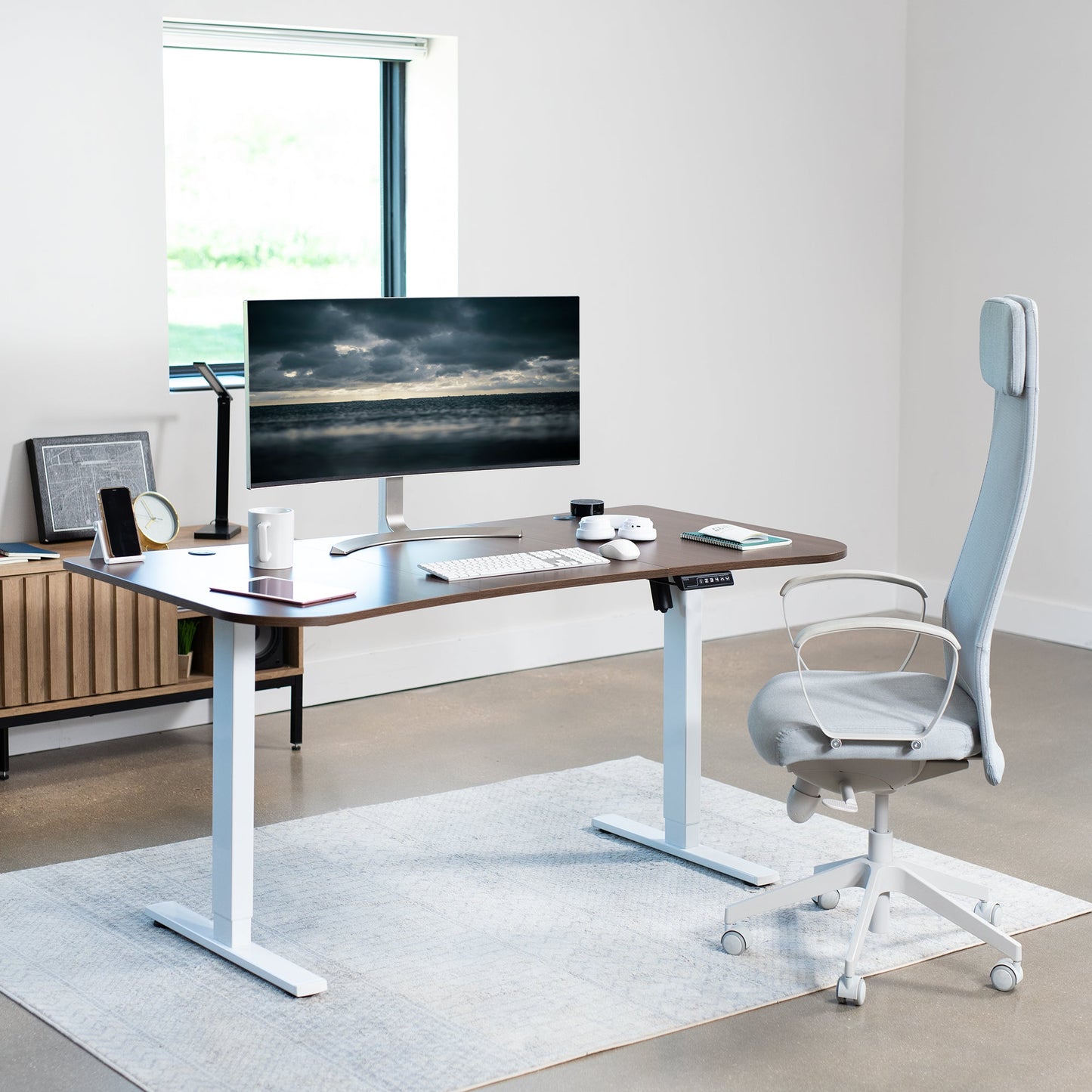 Spacious 63" x 32" Electric Height Adjustable Desk with Convenient Push Button Memory Control